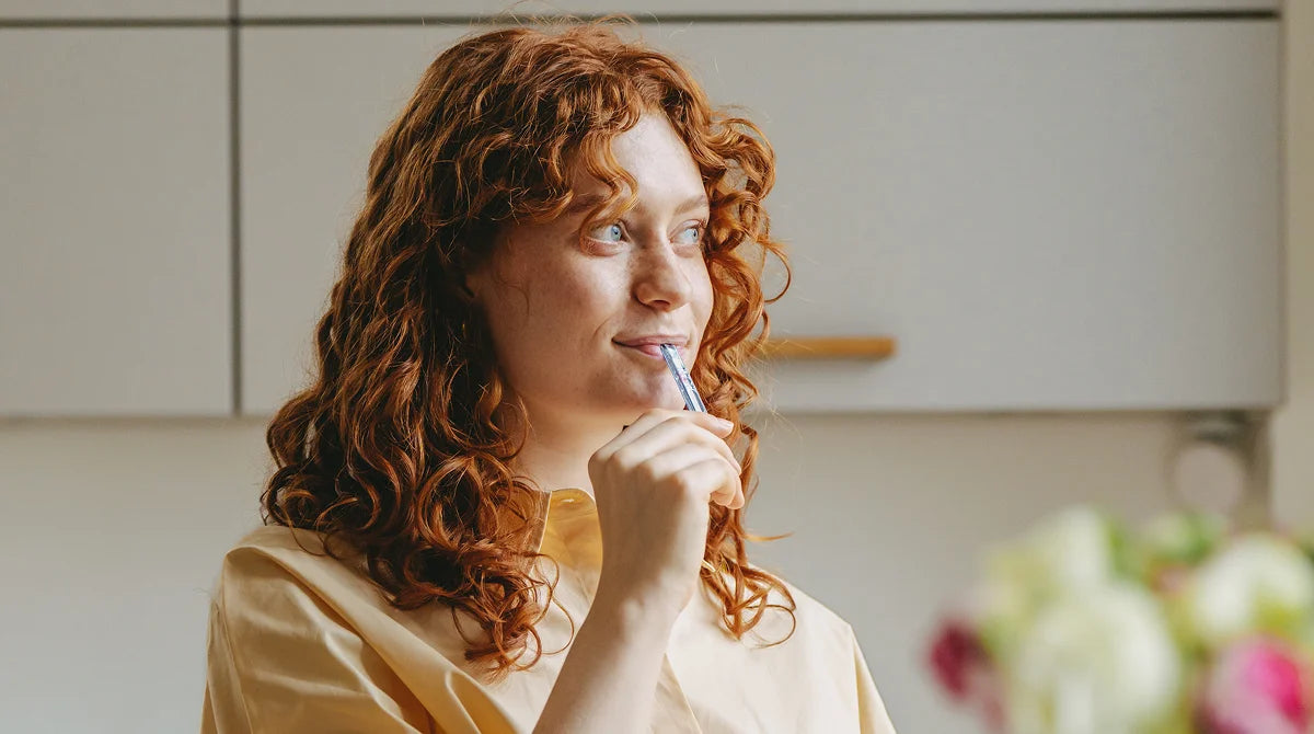 Woman holding an inne test strip